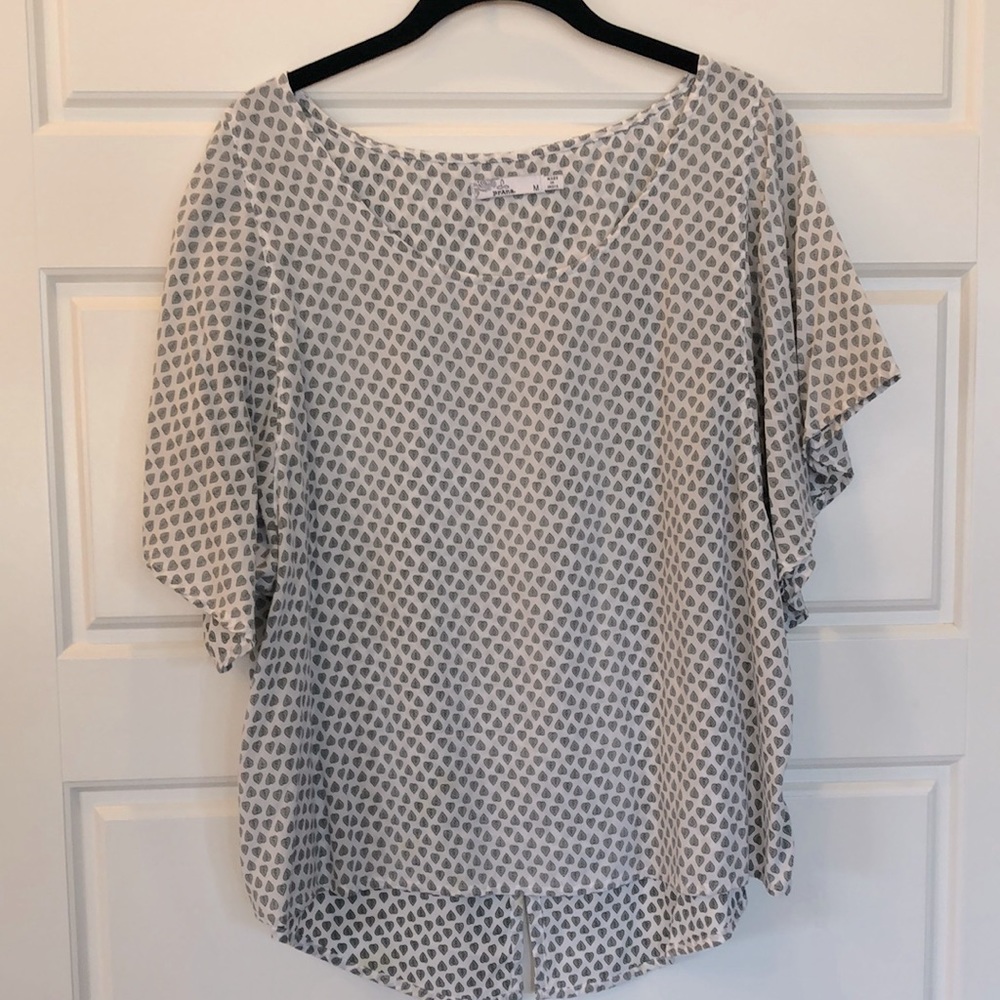 Prana brand. Very comfy and lightweight top. Bell short sleeves.